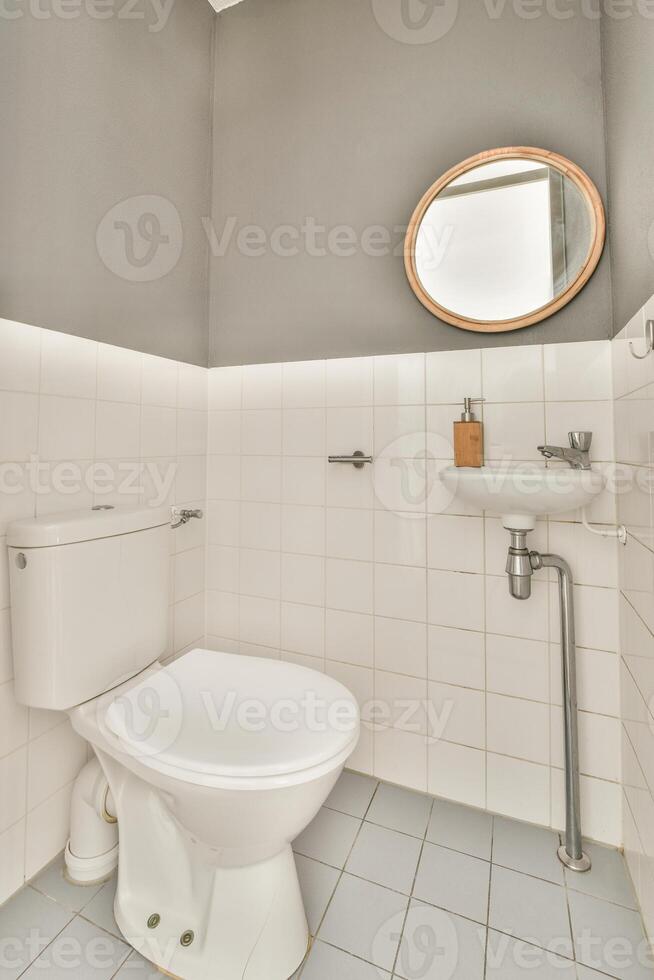 A white toilet sitting in a bathroom photo