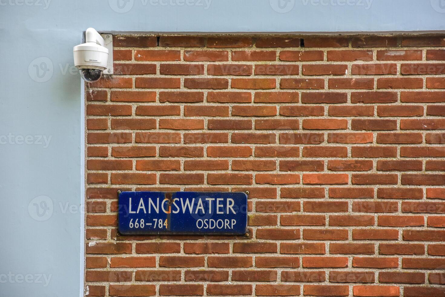 Langswater street sign on a brick wall photo