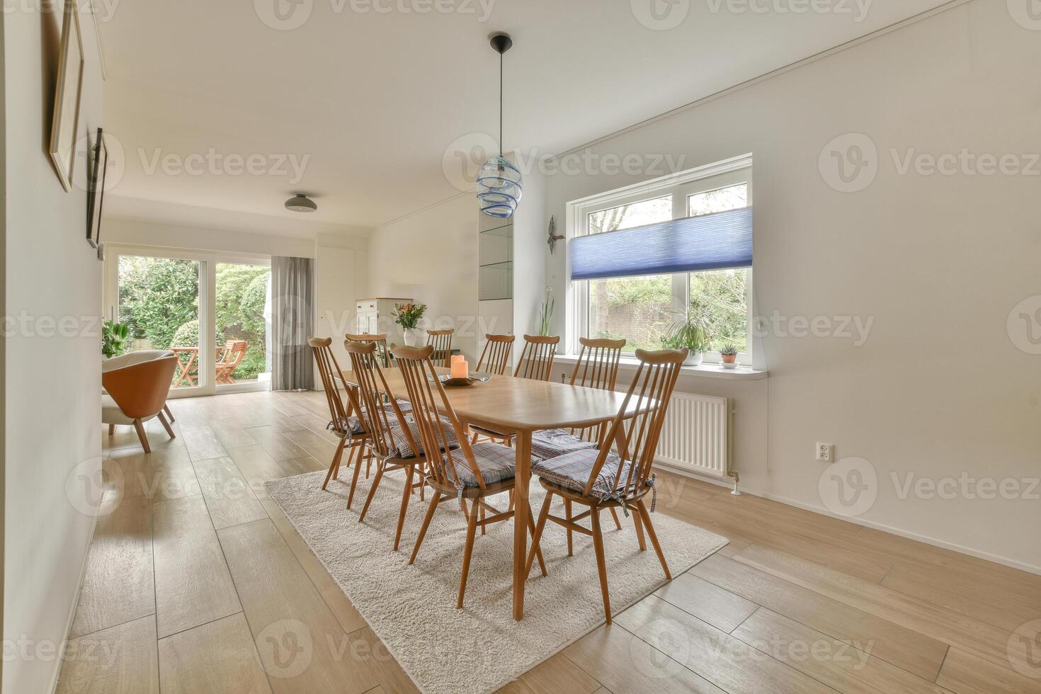 A dining room with a table and chairs photo