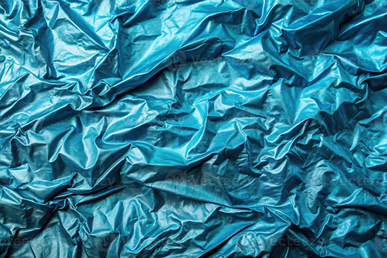 Tropical blue foil texture with a wrinkled and then smoothed background surface captured from an aerial perspective, undulating, metallic, decorative, tranquil, background, reflective photo