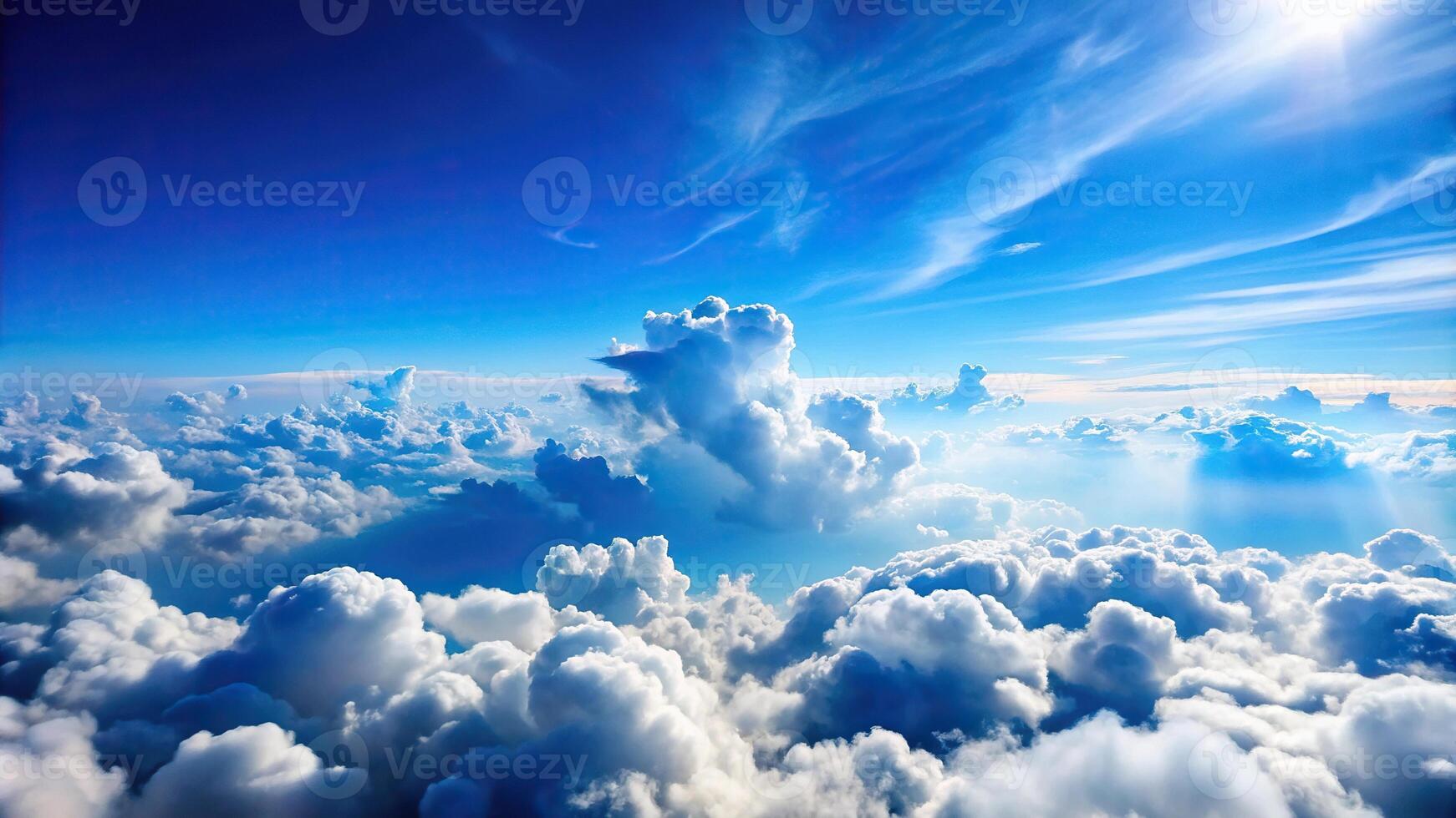 Abstract background of white clouds on blue sky seen from above photo