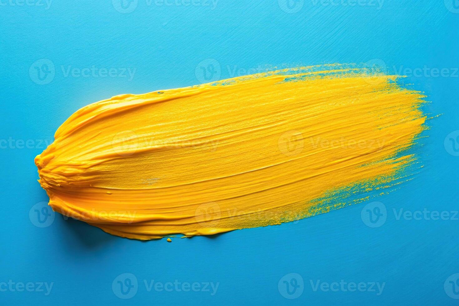 Abstract art featuring a bright yellow paint stroke on a blue background from a long shot perspective photo
