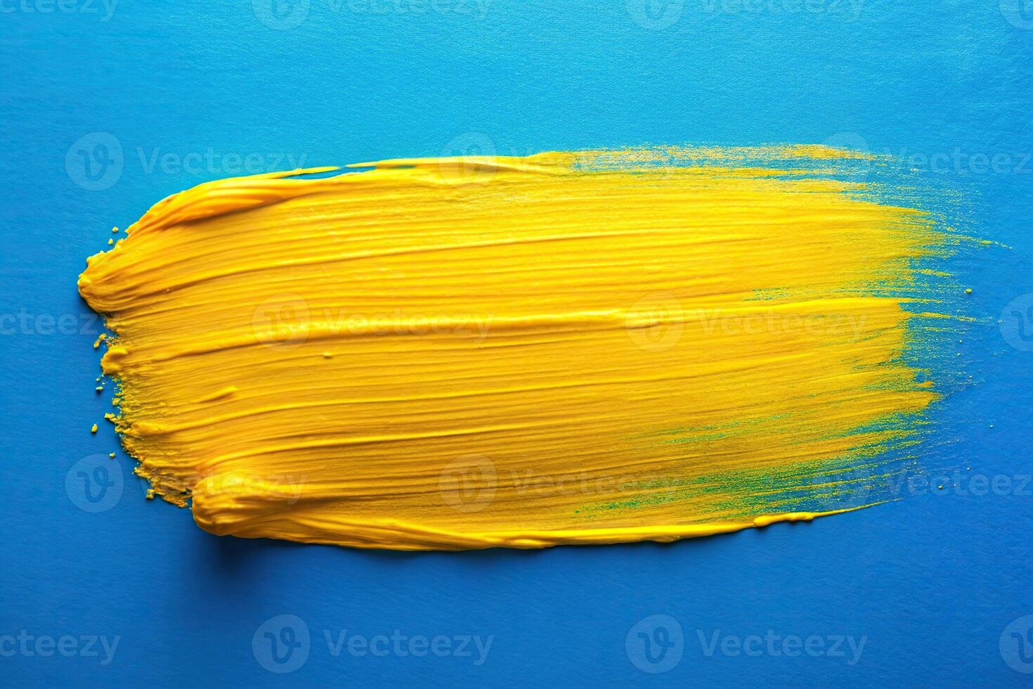 abstract art of long shot bright yellow paint stroke on blue background photo