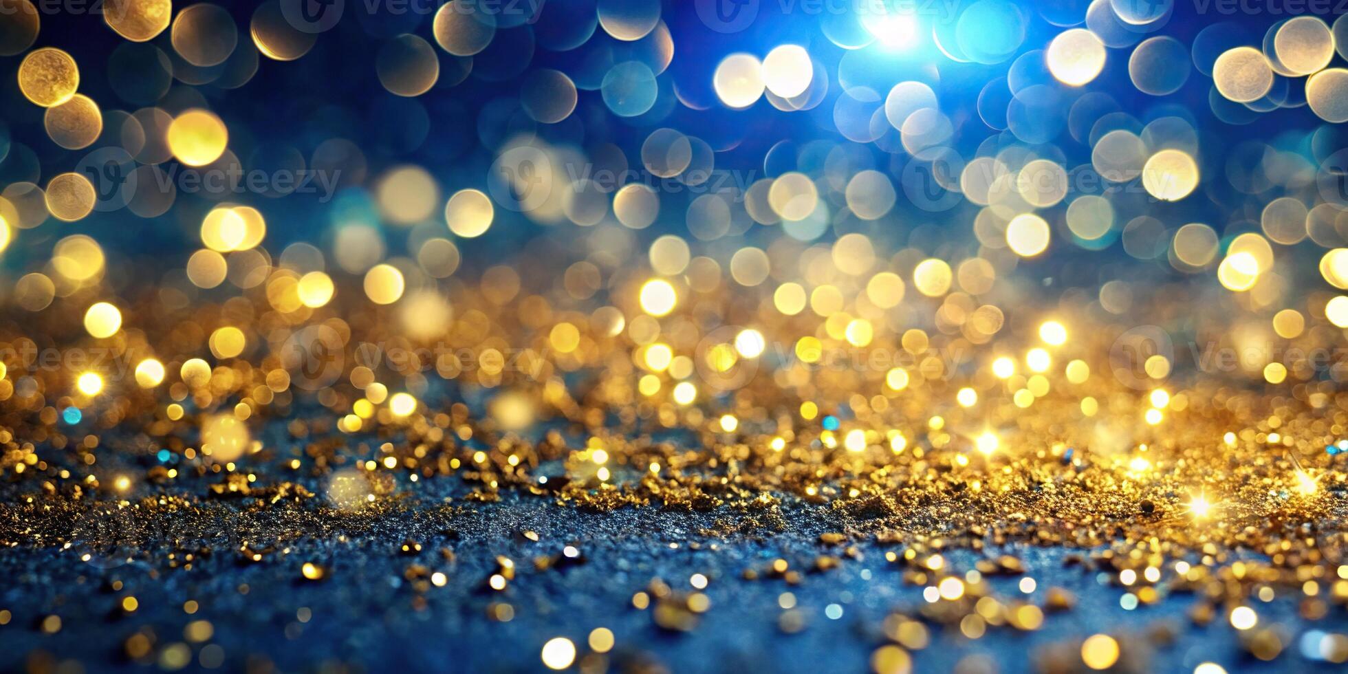 Abstract background of defocused gold glitter lights, confetti, and bokeh on blue backdrop photo