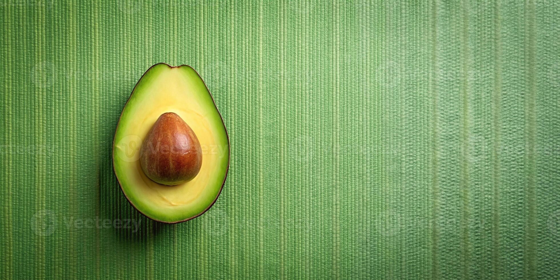 A seamless pattern of aerial avocado half background for stock photo