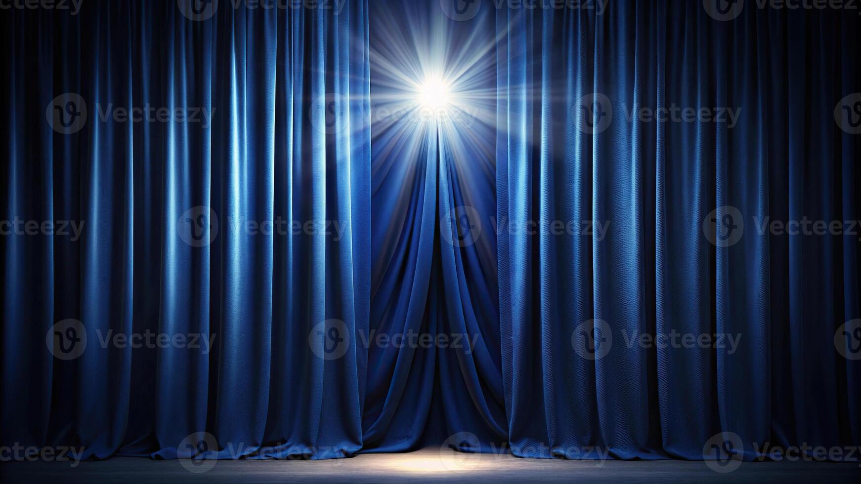 Dark blue curtain with light shining through photo