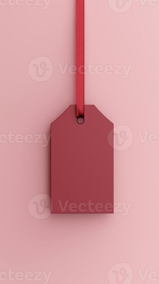 Rectangular red blank paper tag label price tag with hanging satin rope isolated pink photo