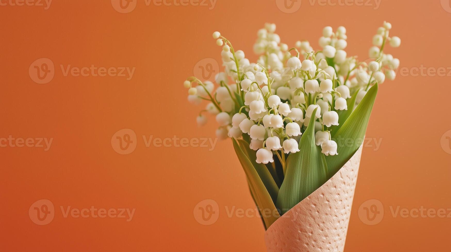 Lily of the valley flower on brown paper wrap bouquet eco friendly package solid background photo