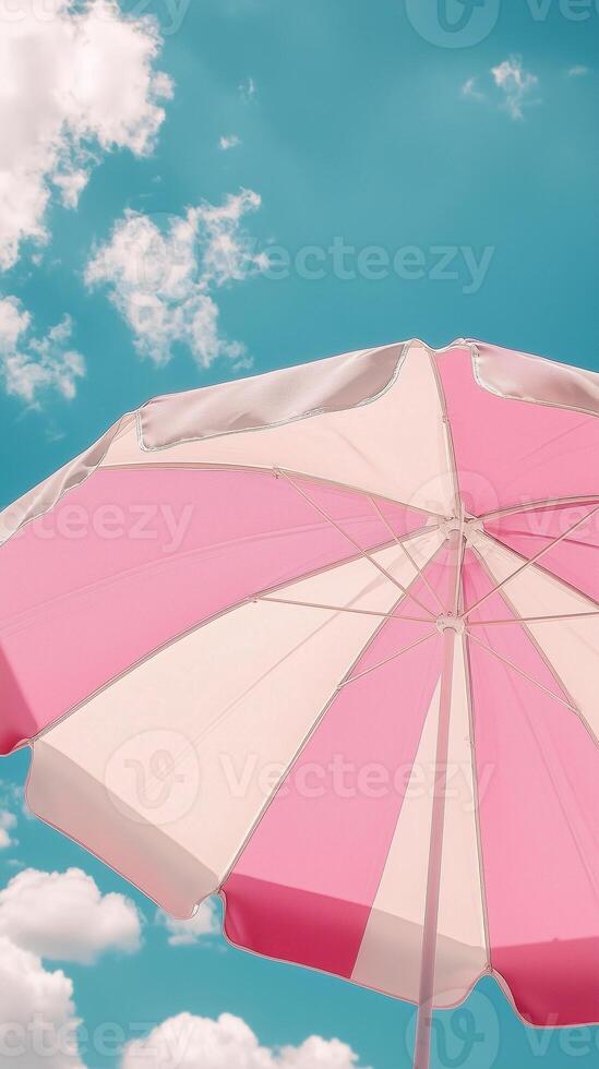 Umbrella pink and white beach for sunburn protection and blue sky bottom view photo
