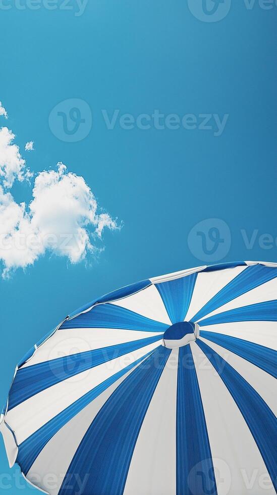 Umbrella blue and white beach for sunburn protection and blue sky bottom view photo