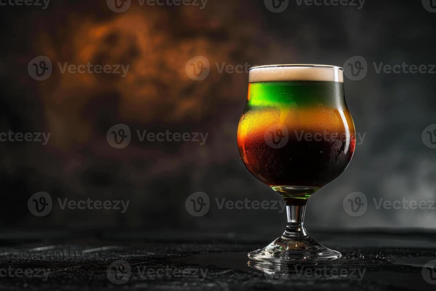 A glass of beer with a colorful liquid photo