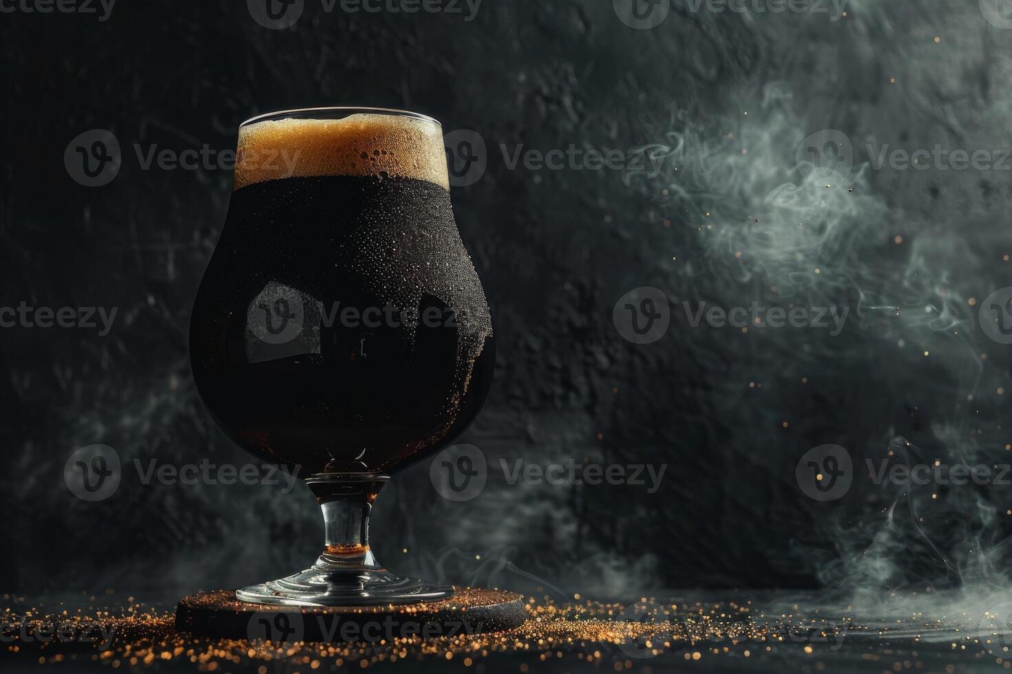 A glass of dark beer on a table photo