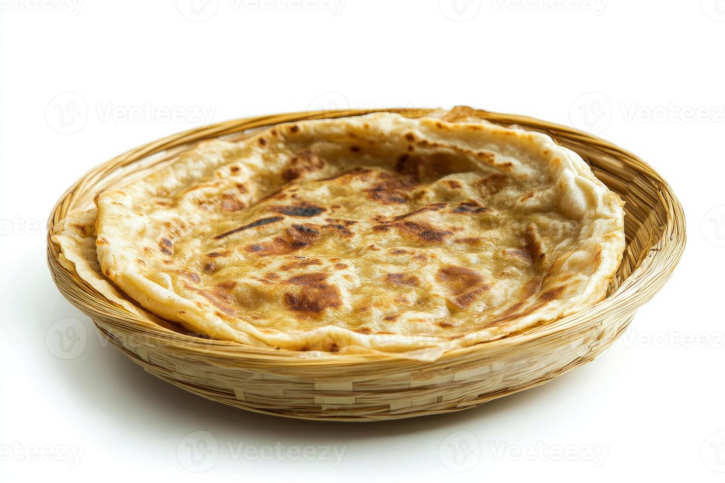 A small flatbread in a basket on a white background photo