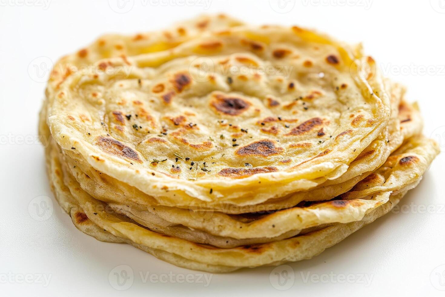 A stack of flatbreads on a white surface photo