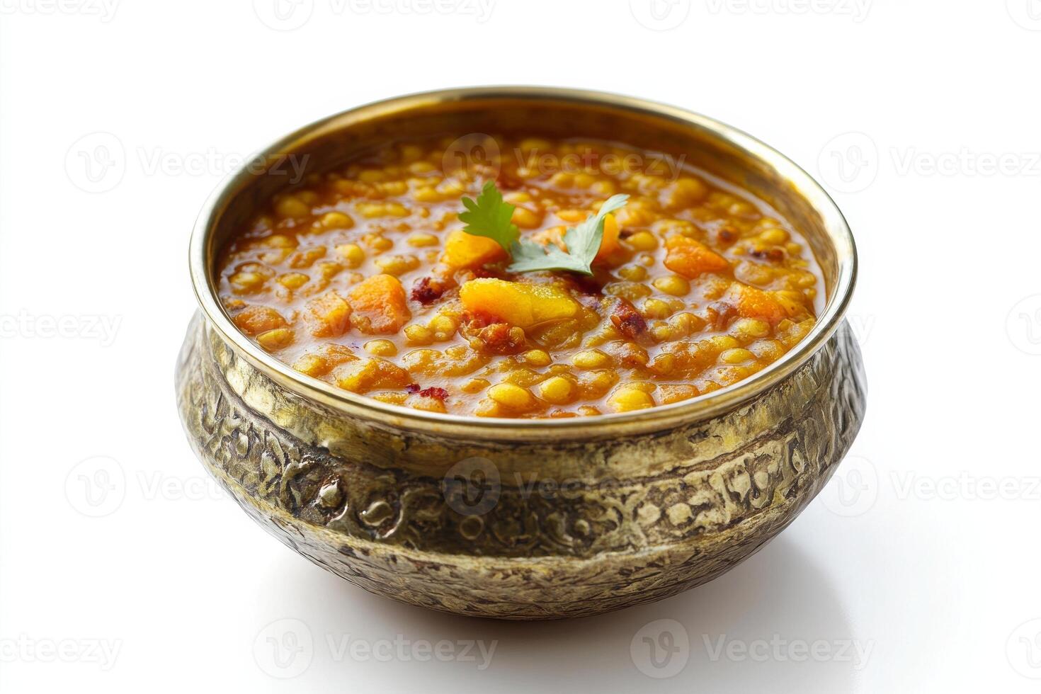A bowl of lentil soup with a garnish of parsley photo