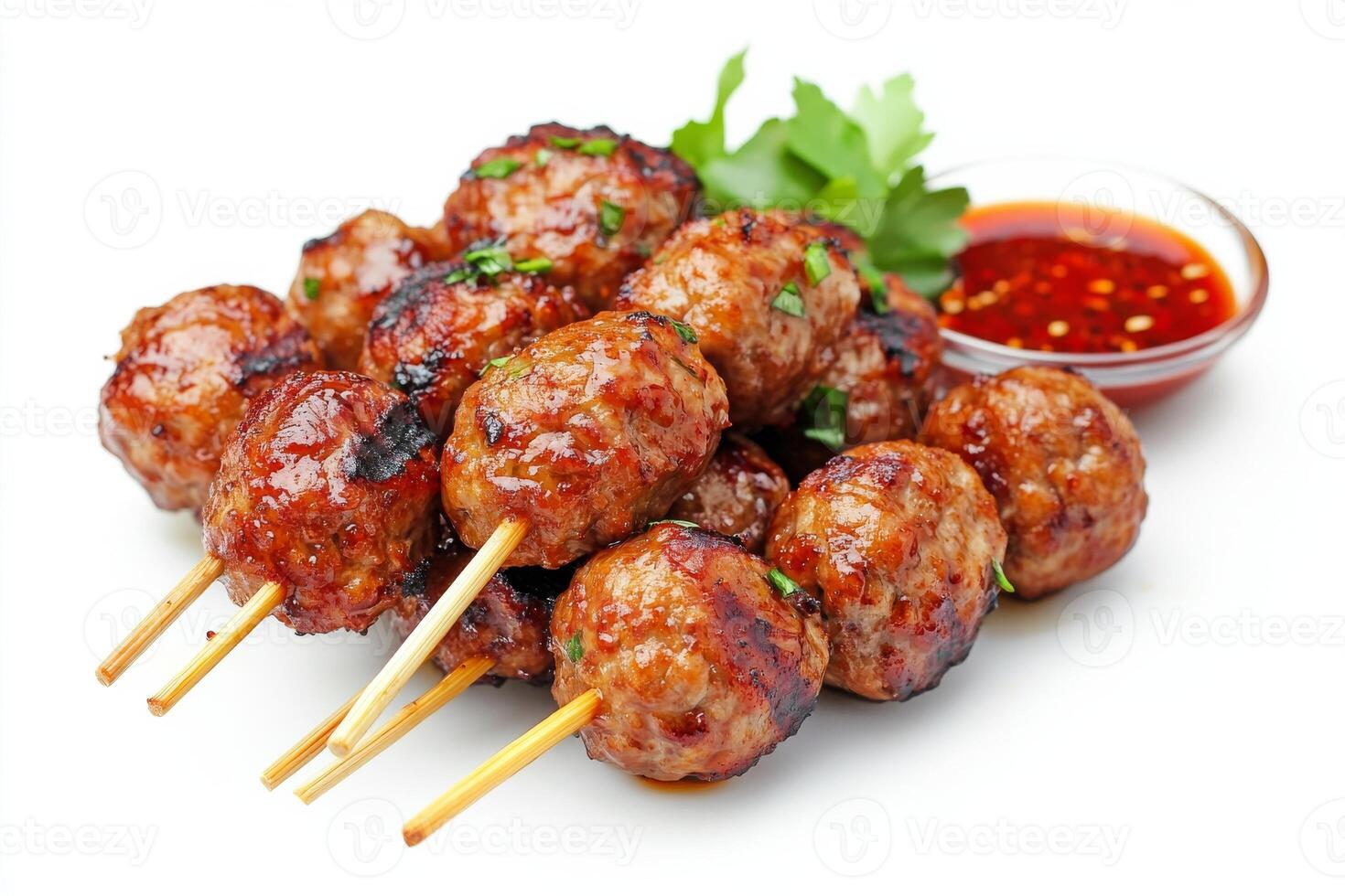 Meat skewers with sauce and garnish photo