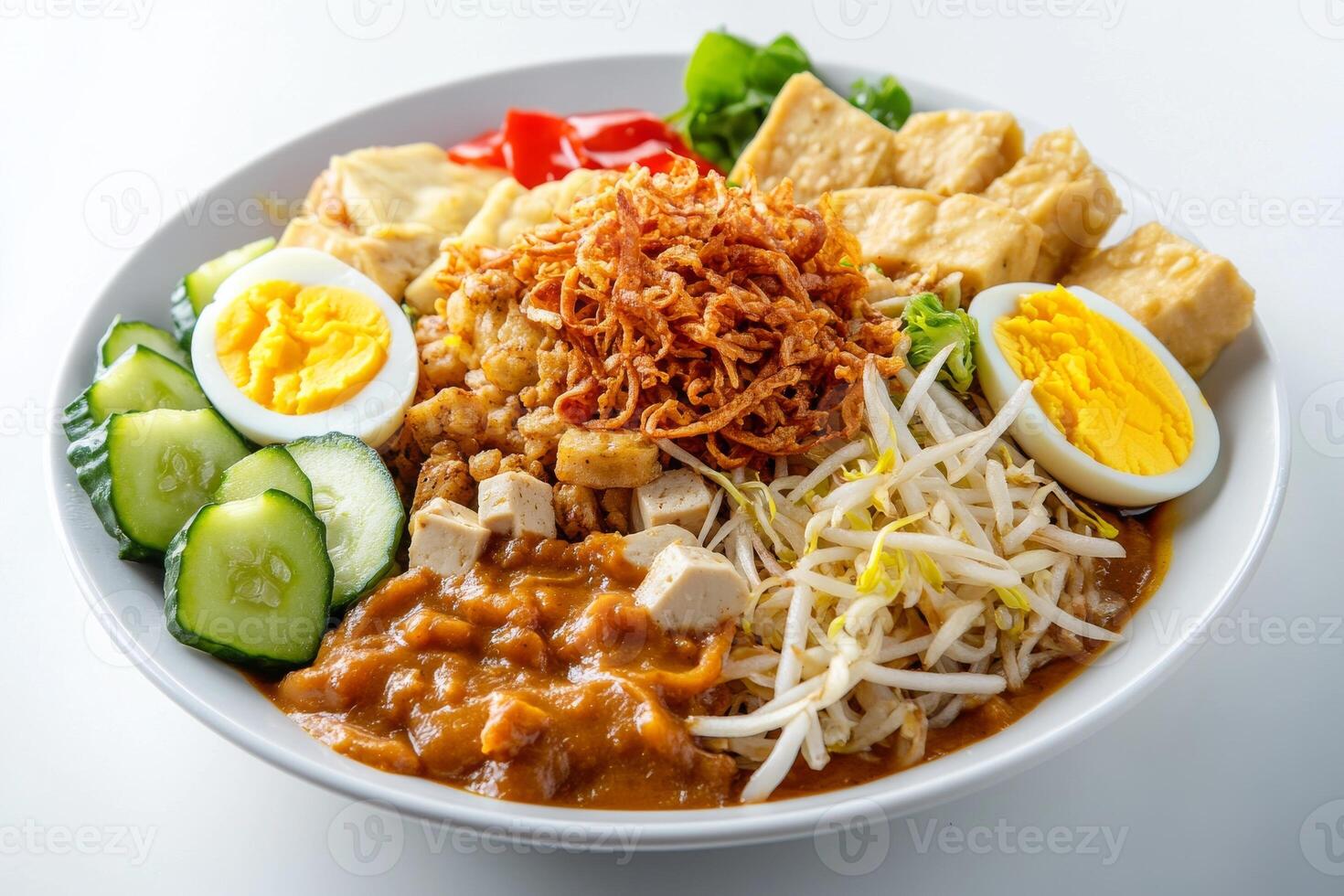 A bowl of food with noodles, eggs, and vegetables photo