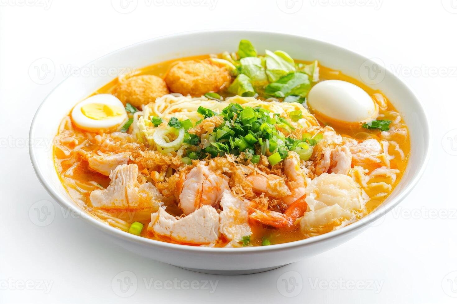 A bowl of ramen with meat, eggs and vegetables photo