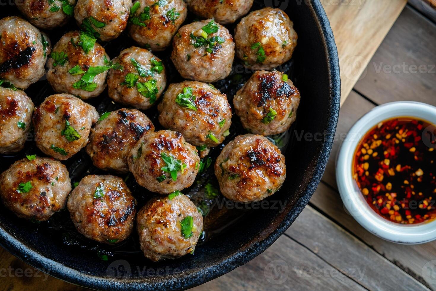 A pan filled with meatballs and sauce photo