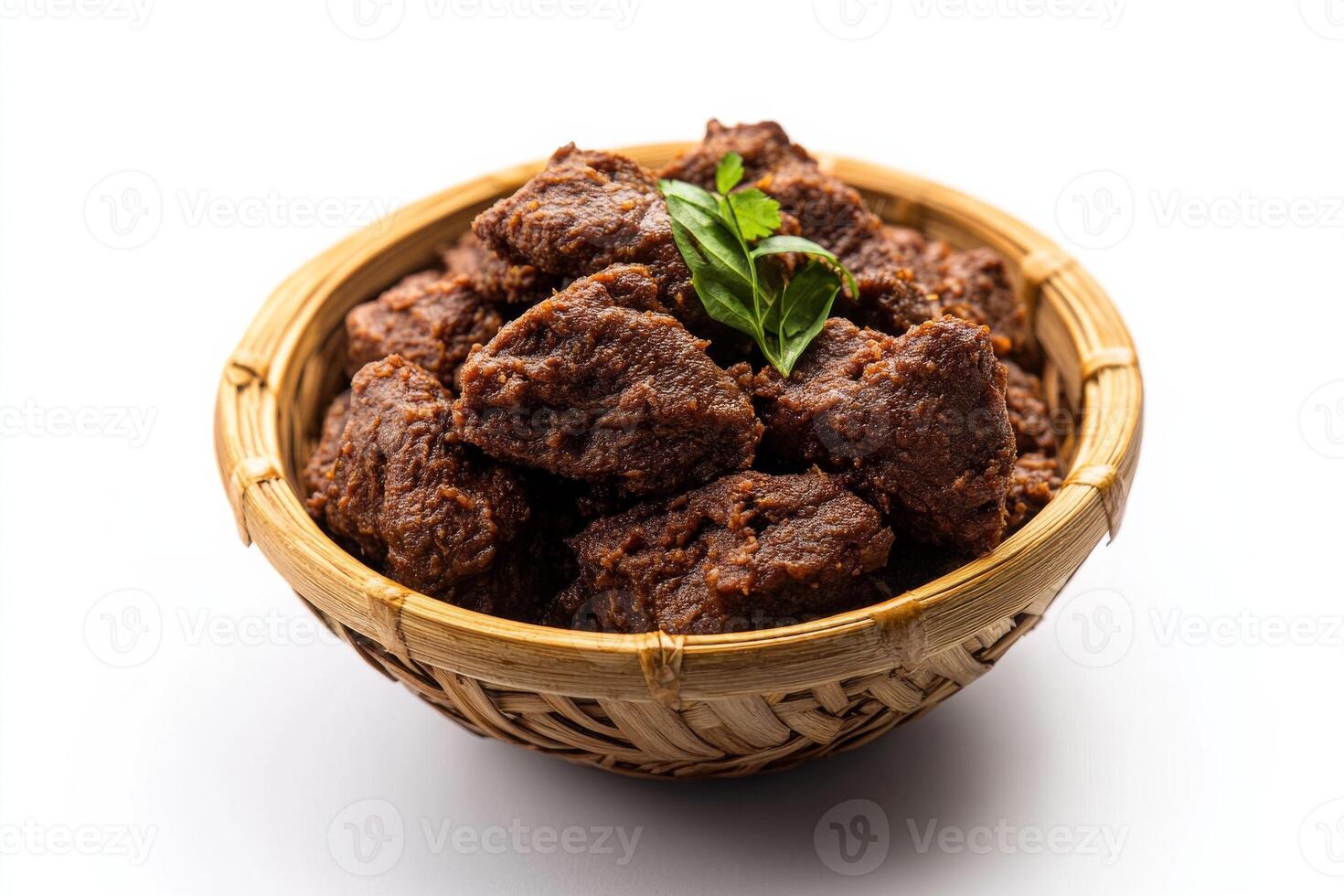 A bowl filled with meat and herbs on a white background photo