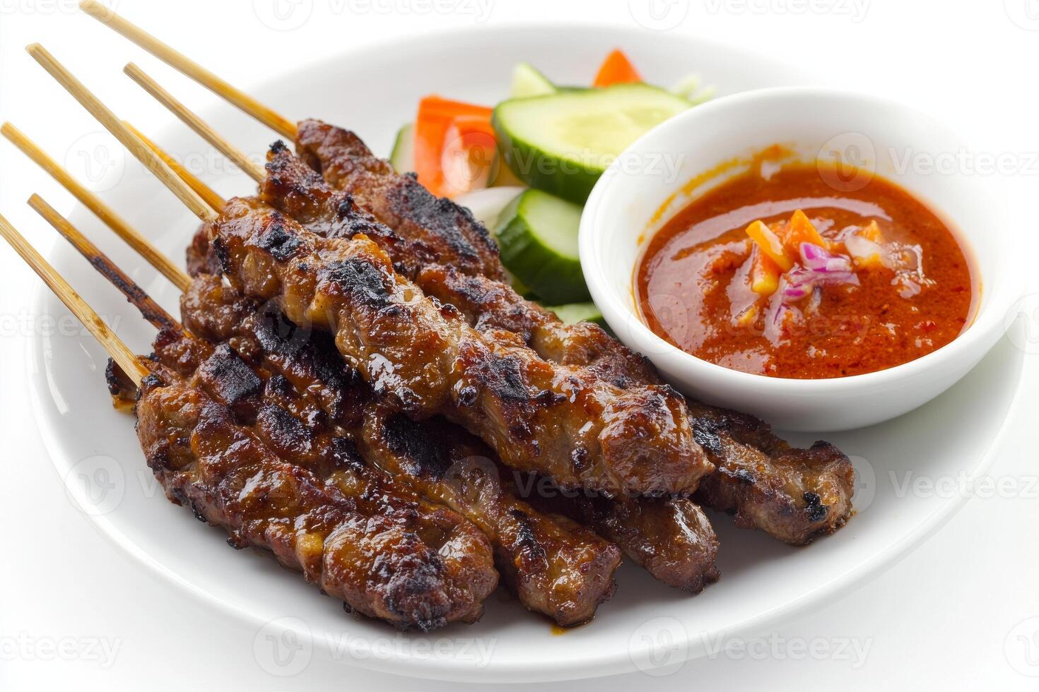 A plate with meat skewers and sauce photo