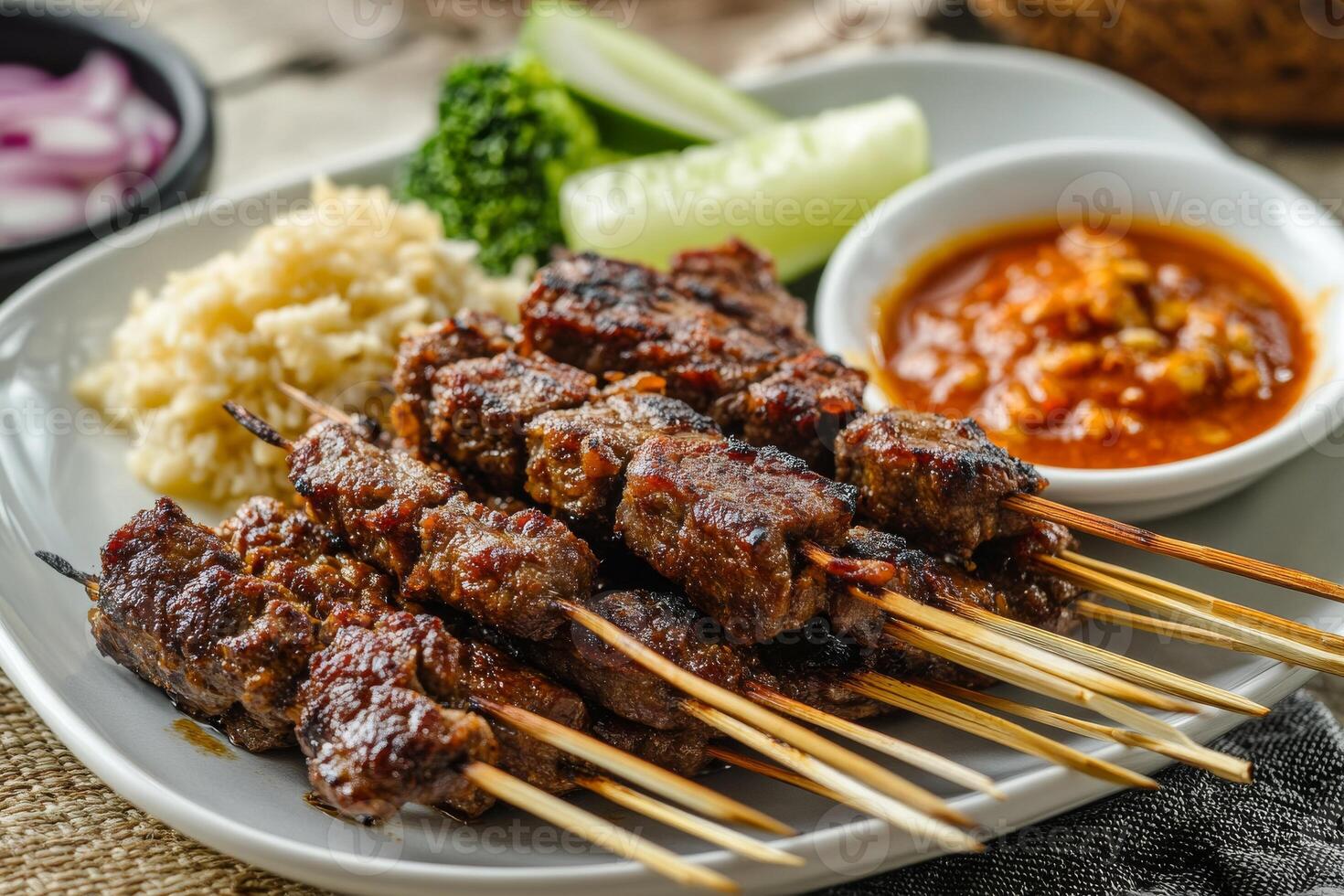 A plate with meat skewers and sauce photo
