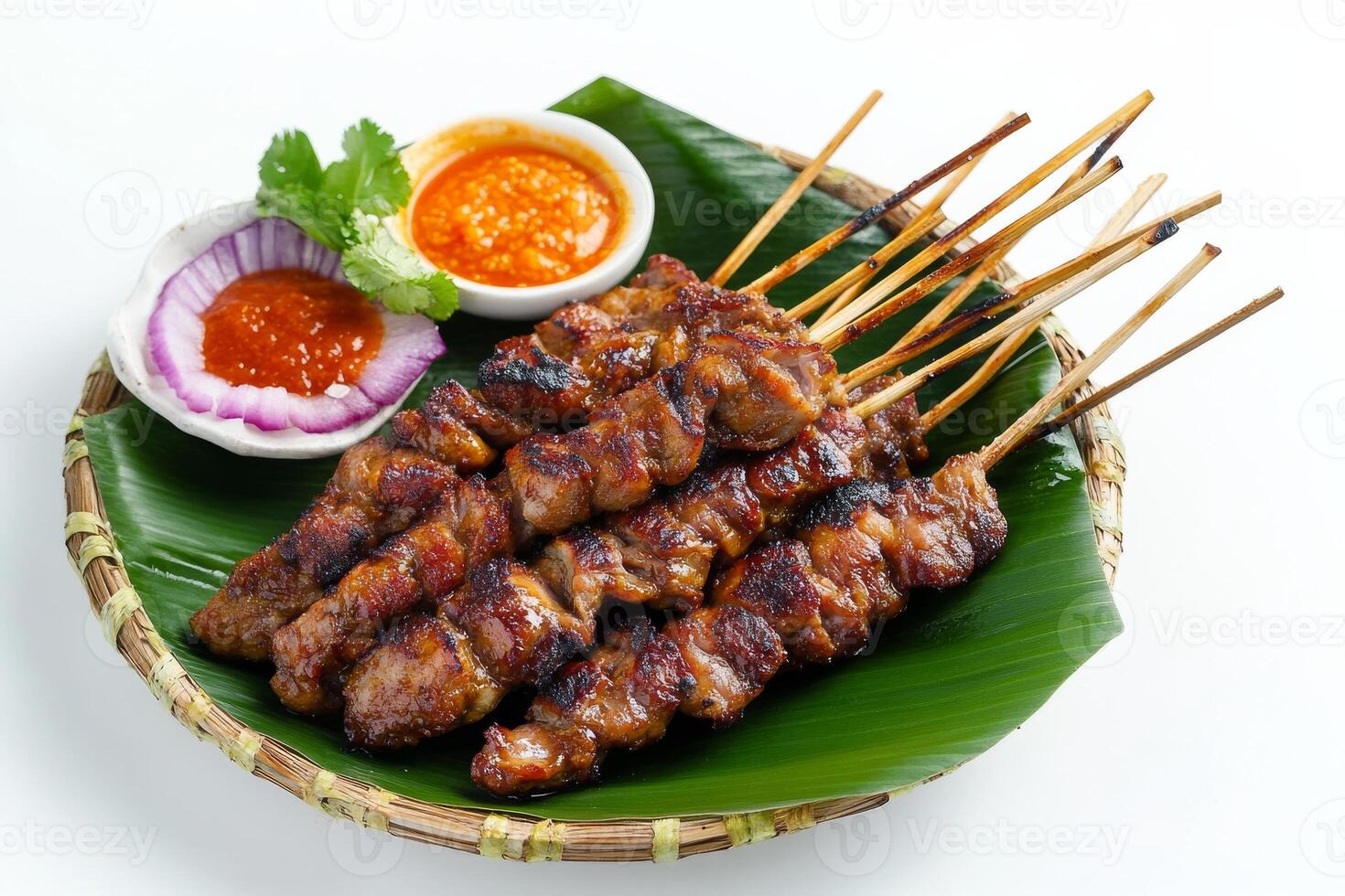 A plate with skewers of meat and sauce photo