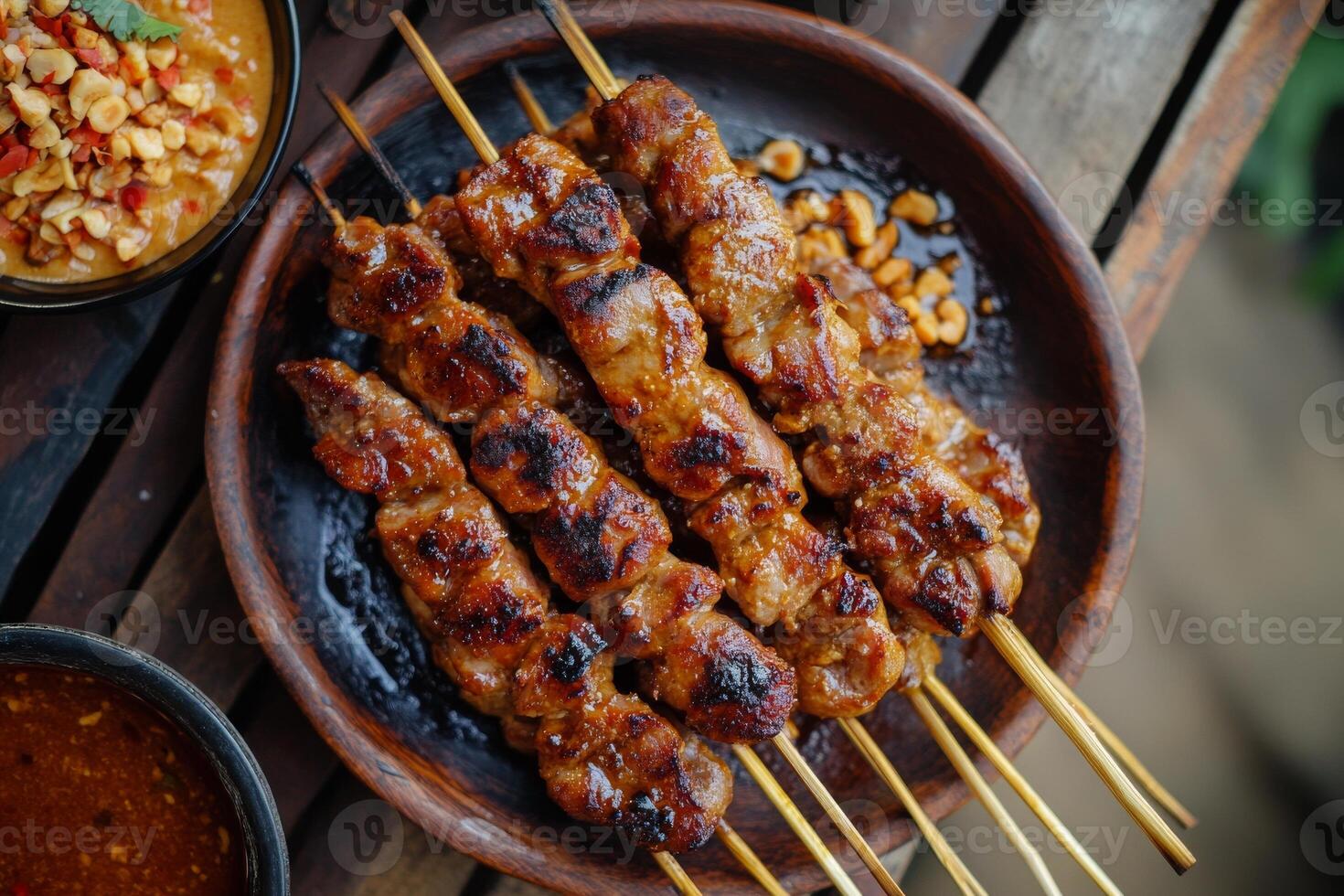 Thai food on skewers with sauce and dipping sauce photo