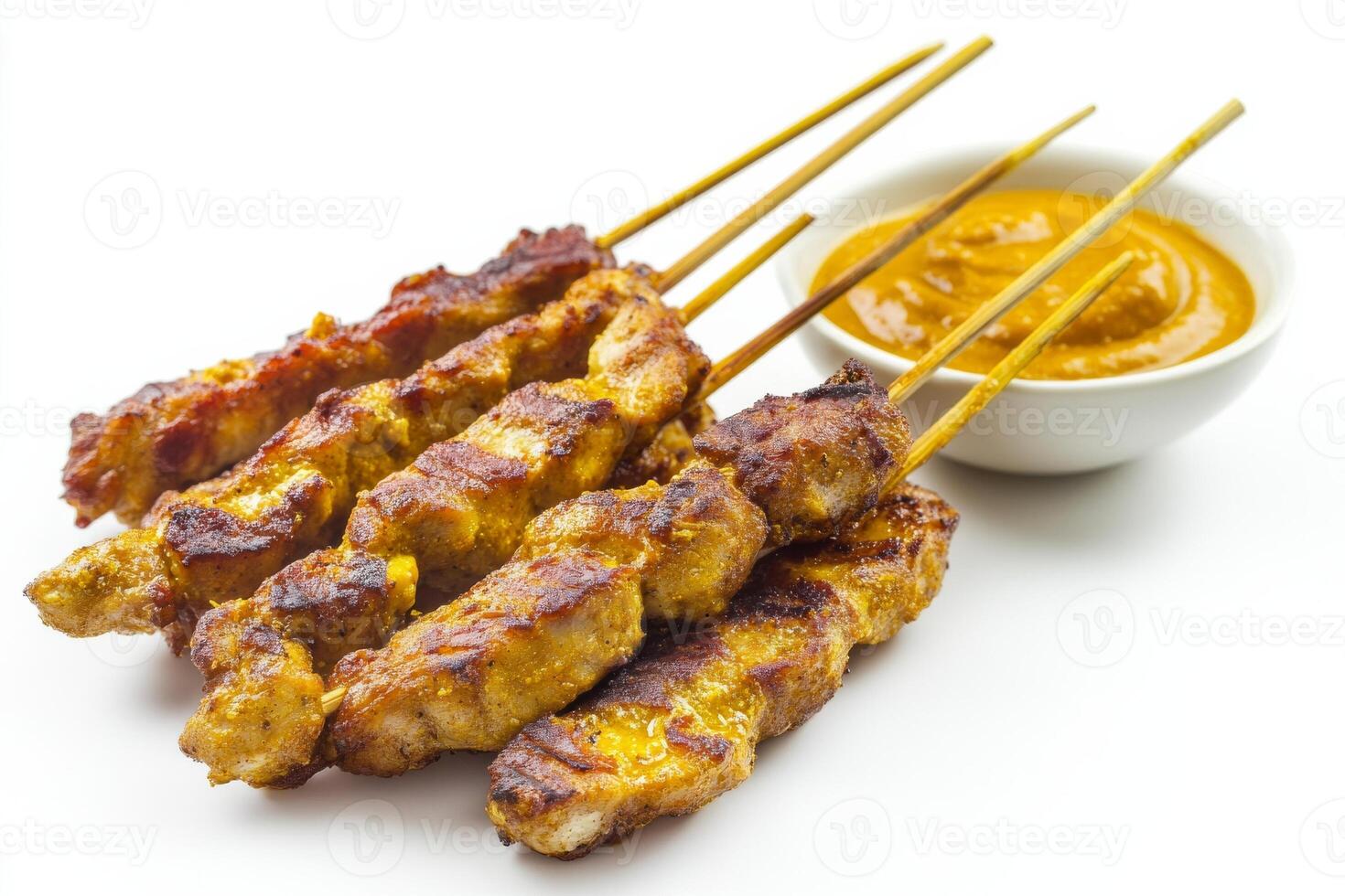 Chicken satay on sticks with dipping sauce photo