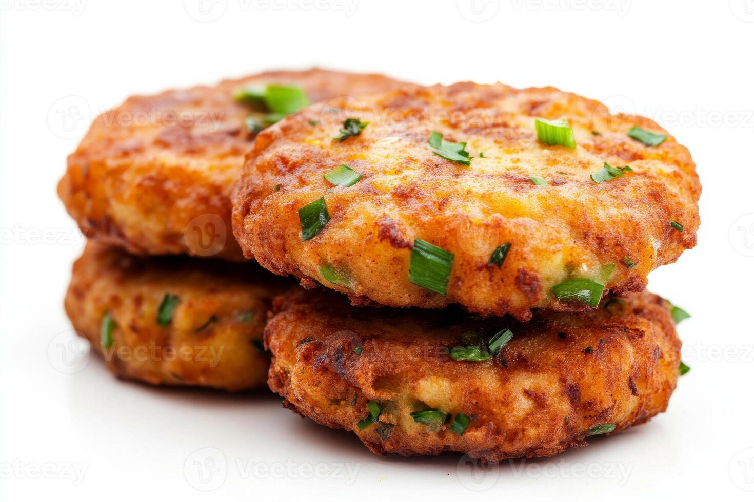 Three cheese patties with green onions on top photo