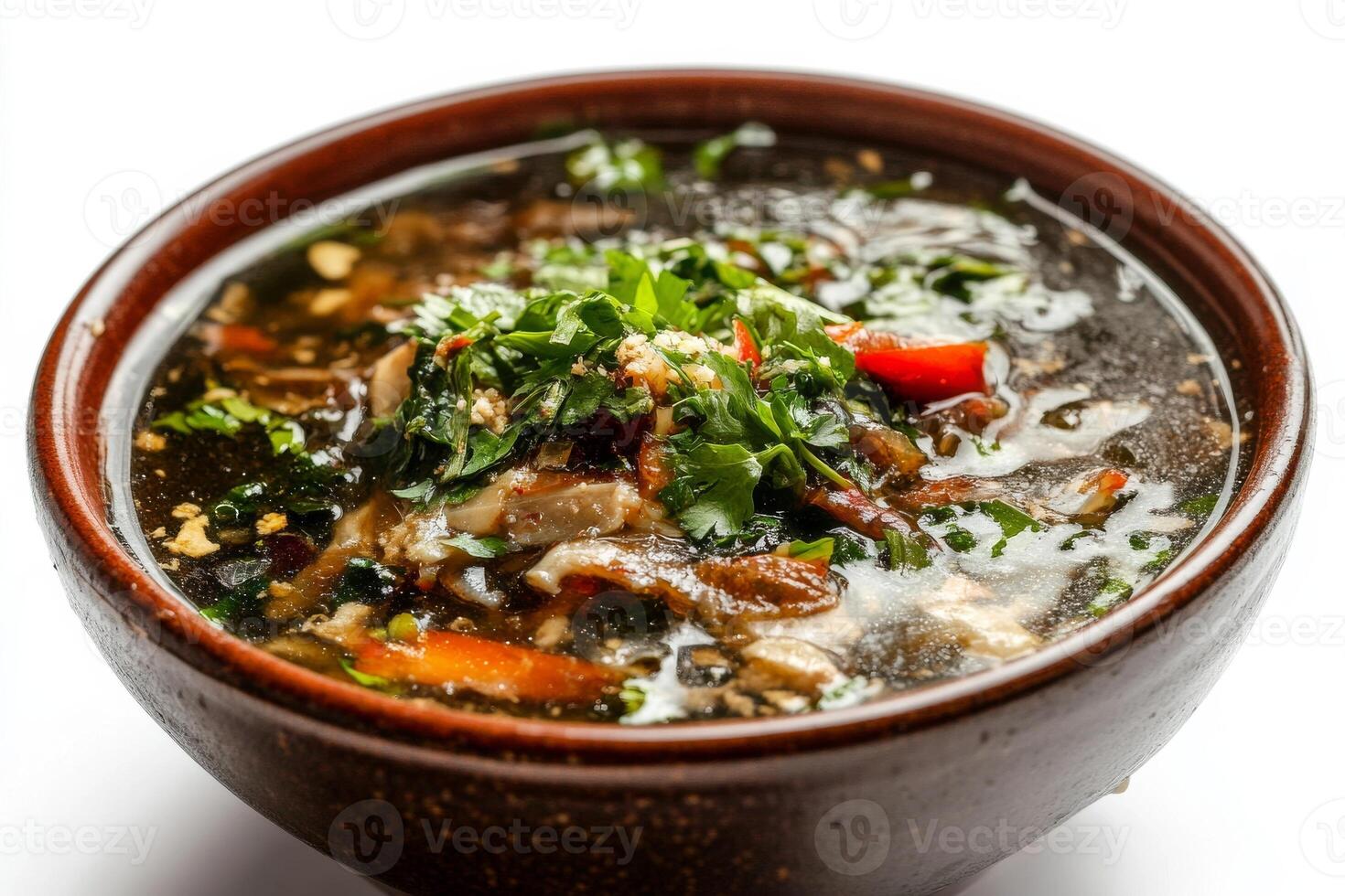 A bowl of soup with meat and vegetables photo