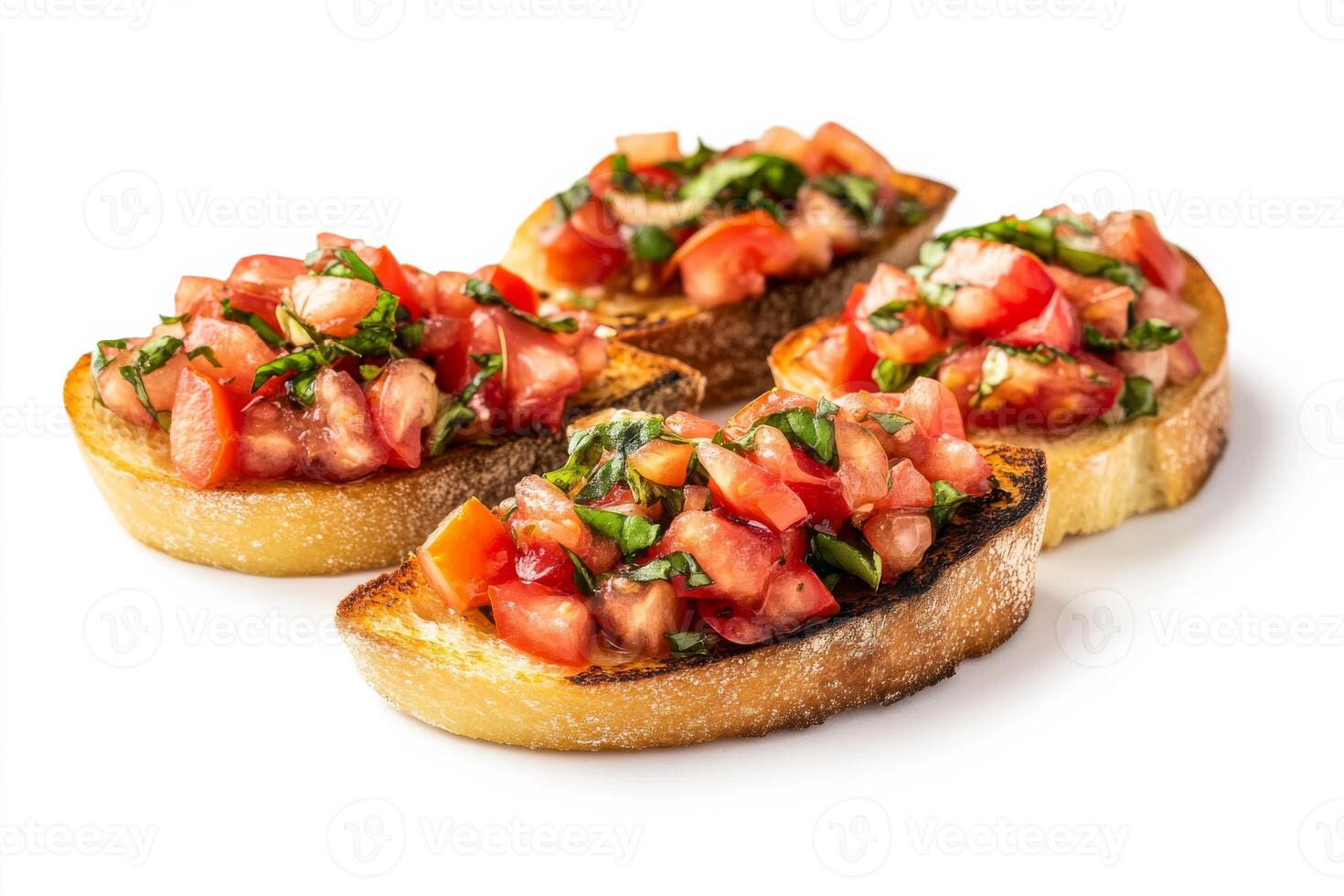 Four slices of bread with tomato and basil on them photo