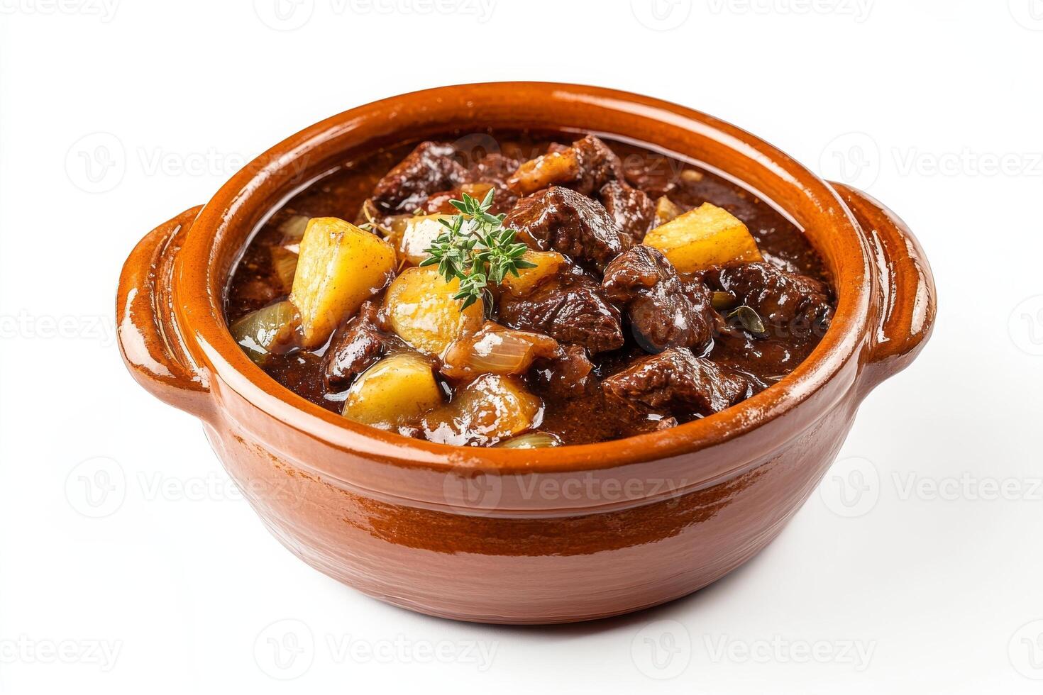 A brown bowl filled with stew and vegetables photo