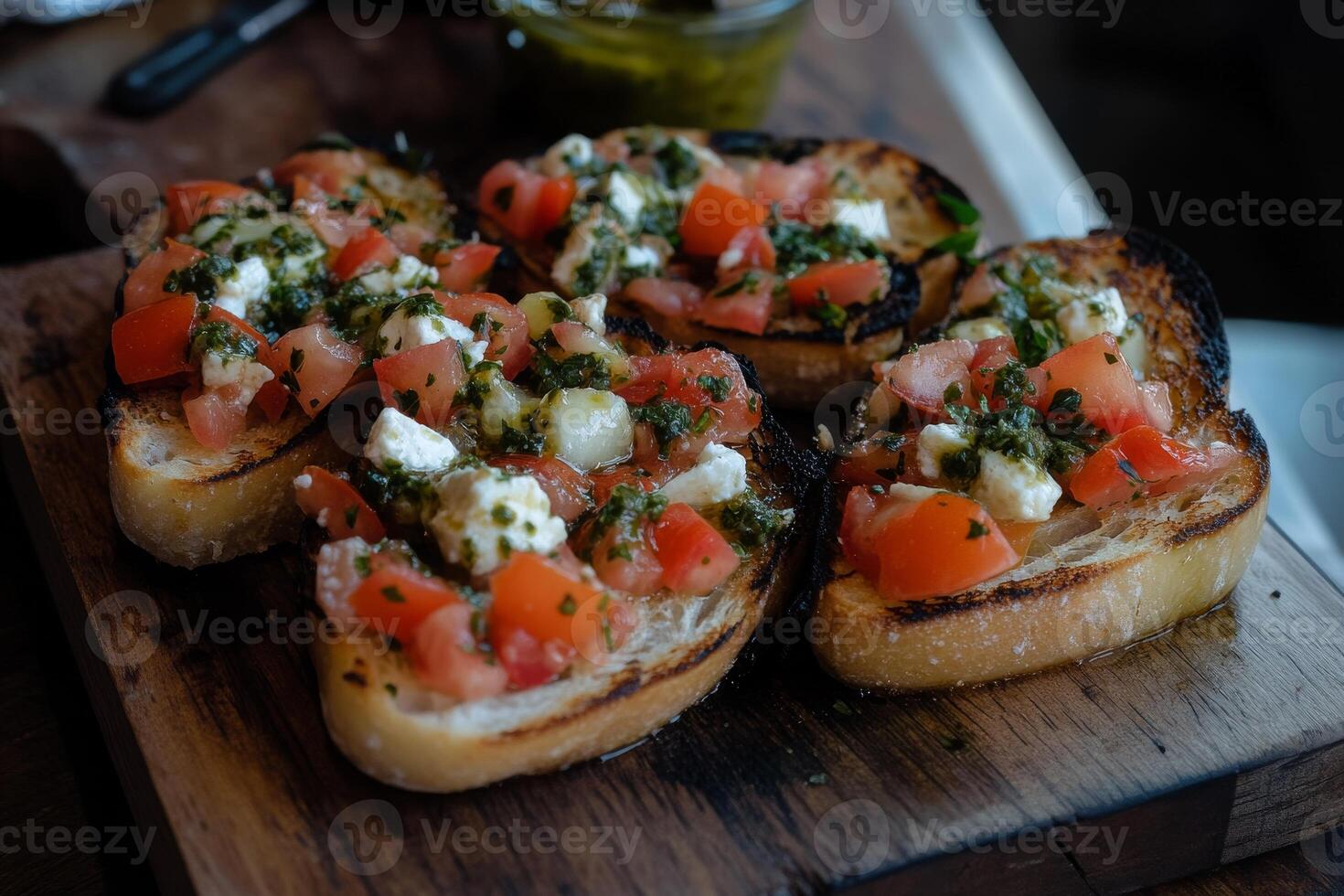A wooden board topped with four pieces of bread photo