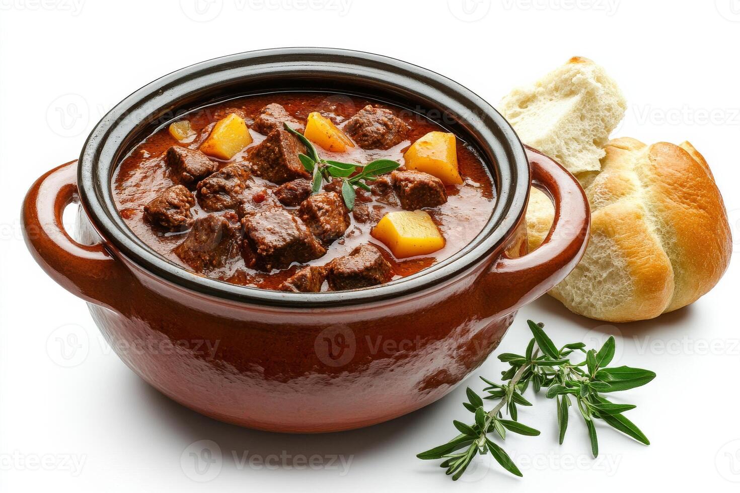 Beef stew in a brown clay pot with bread on a white background photo