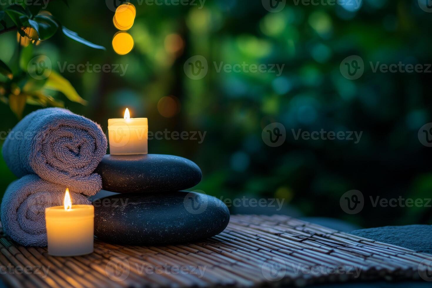 Spa stones with candles and towels photo