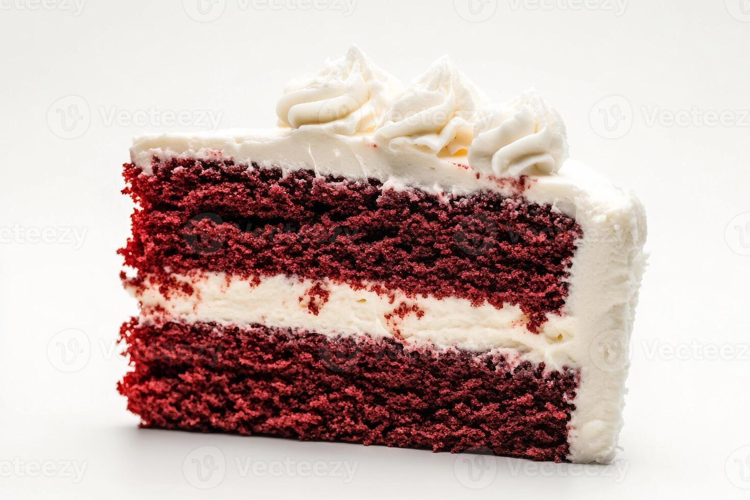 A piece of red velvet cake with white frosting photo