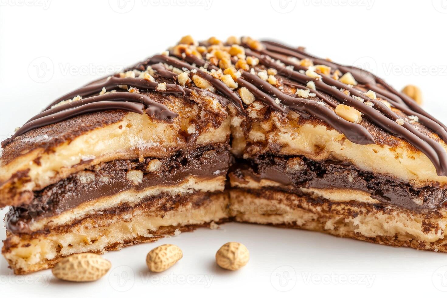 A piece of cake with chocolate and nuts on it photo