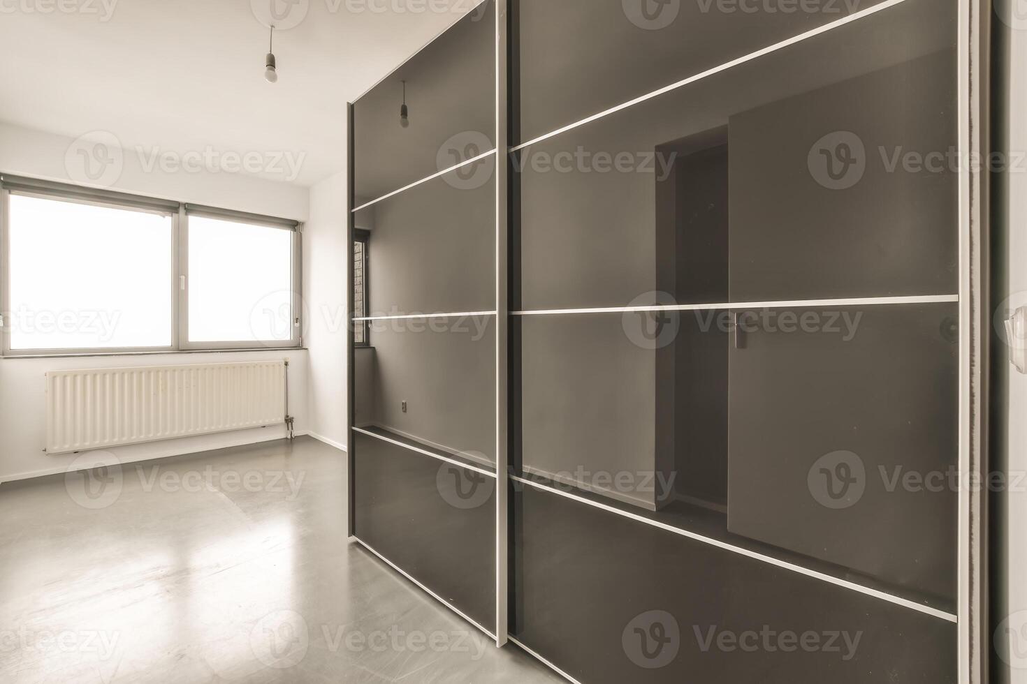 A room with a sliding door and a sliding glass door photo