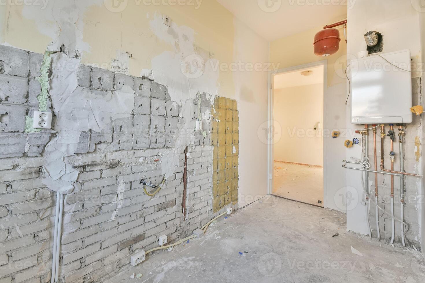 A room with a brick wall and drywall photo
