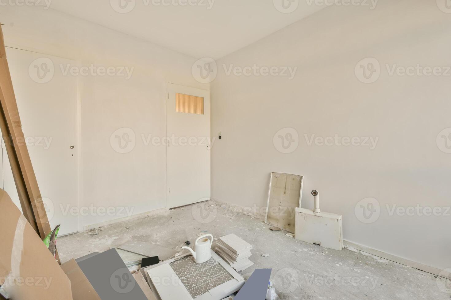 A room with a lot of construction materials and a door photo