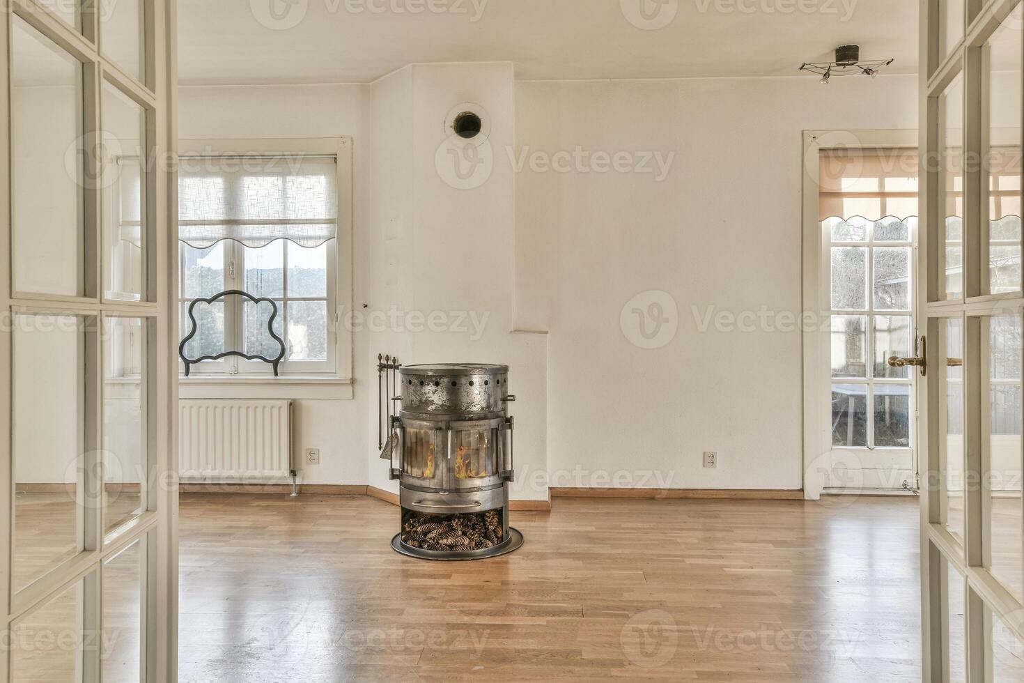 A room with a stove and a window photo