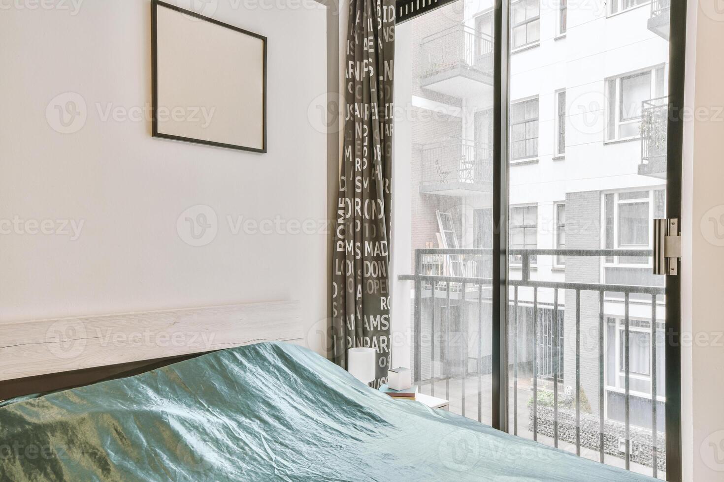A bedroom with a bed and a window photo