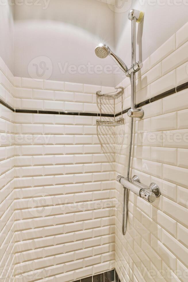 A shower with a shower head and a shower rod photo