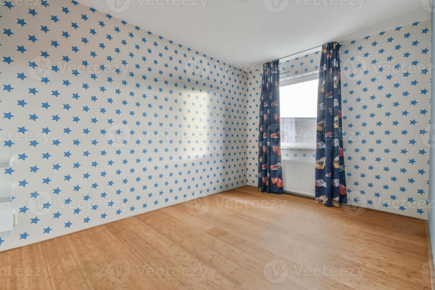 A room with blue and white polka dot wallpaper photo