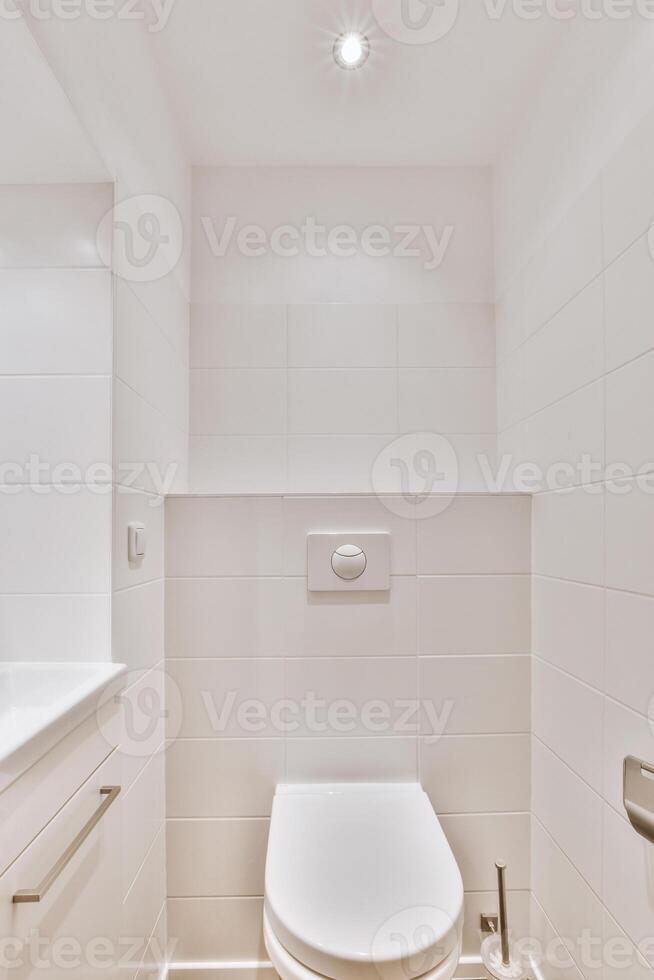 A white toilet in a bathroom photo