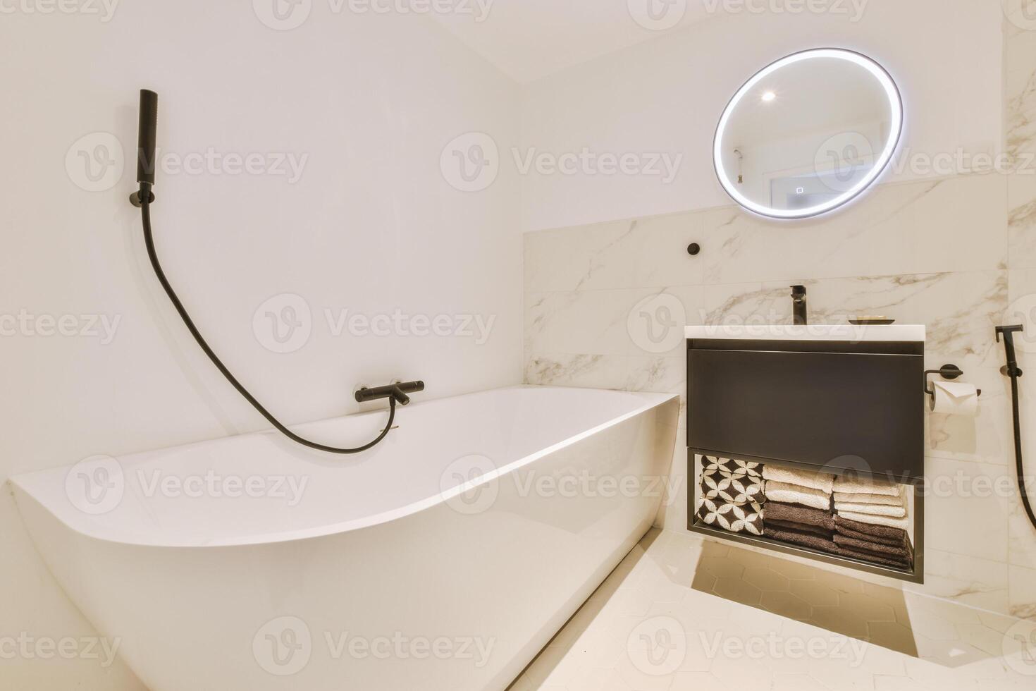 A bathroom with a bathtub and a sink photo