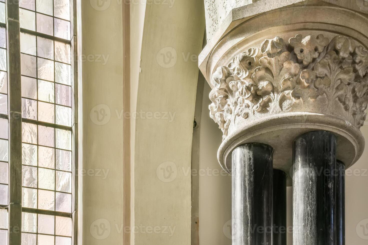 A tall column with a window in front of it photo