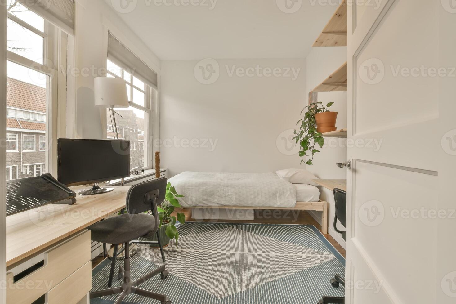 A bedroom with a desk, bed and window photo