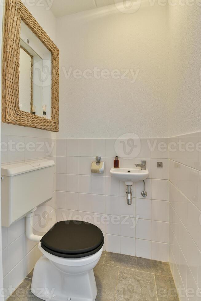 A white toilet in a bathroom photo